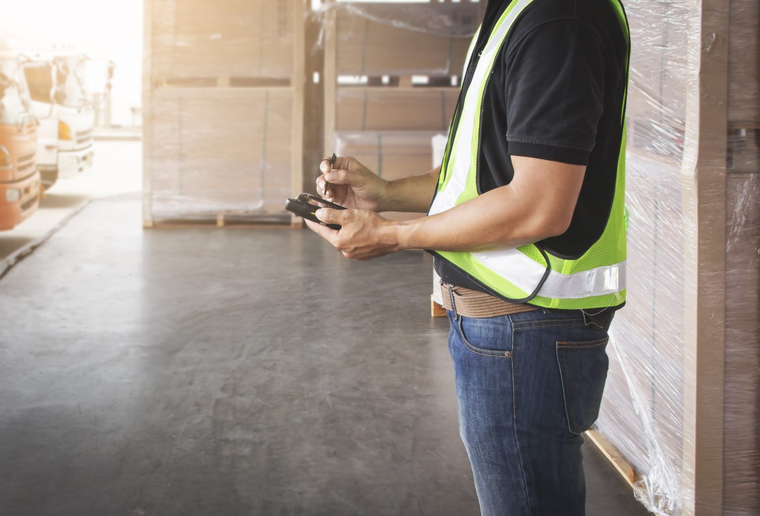 worker is holding smartphone communicating with customer shipping warehouse logistics scaled